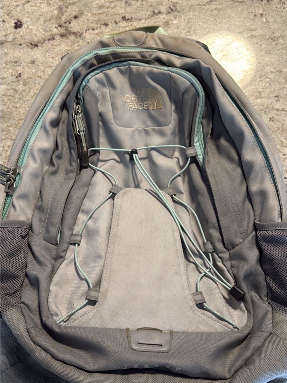 The North Face Grey Backpack with Mint Accents